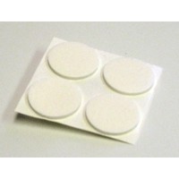 four double-sided round white sticky pads on a small piece of non-stick backing film.