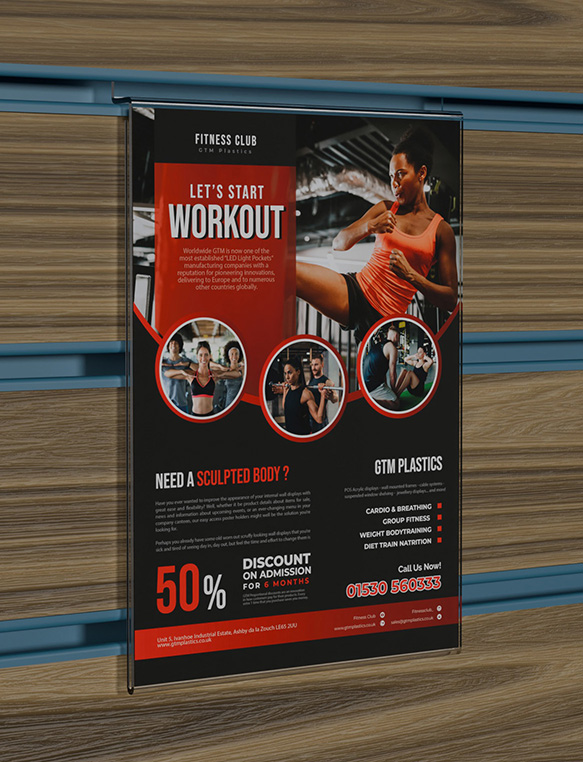 An acrylic slatwall portrait poster holder slotted into a brown wooden board which has blue inserts. The poster shows men and women performing various physical exercises.