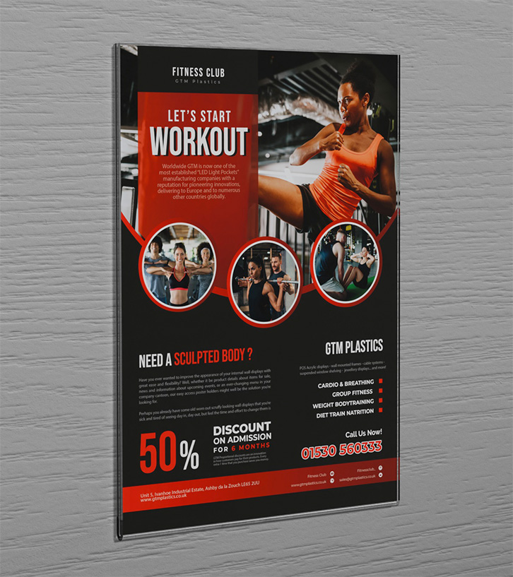 An acrylic wall mounted poster holder attached to the wall with sticky-back hook and loop Velcro. The poster is advertising a fitness club.