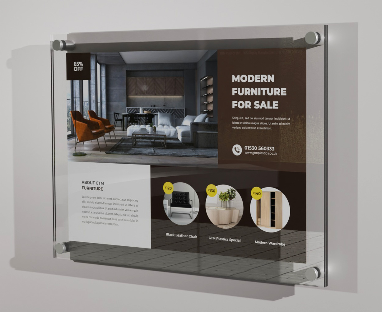 A poster sandwiched between two acrylic panels. Four stand-off clamps attach the display to the wall, portrait. The poster is advertising modern furniture for sale.