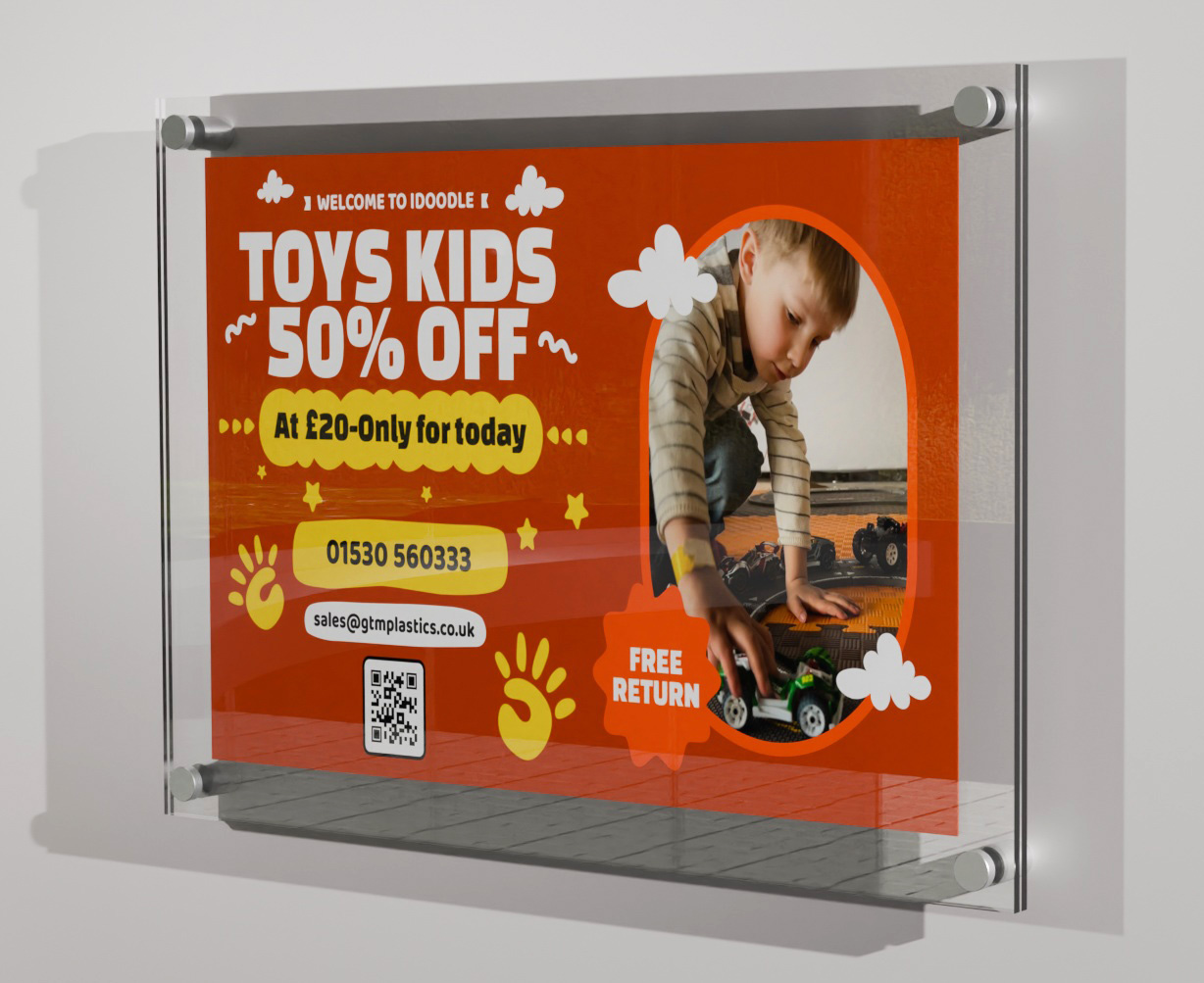 A poster sandwiched between two acrylic panels. Four stand-off clamps attach the display to the wall, landscape. The poster is advertising a kids toys discount 50 percent off.